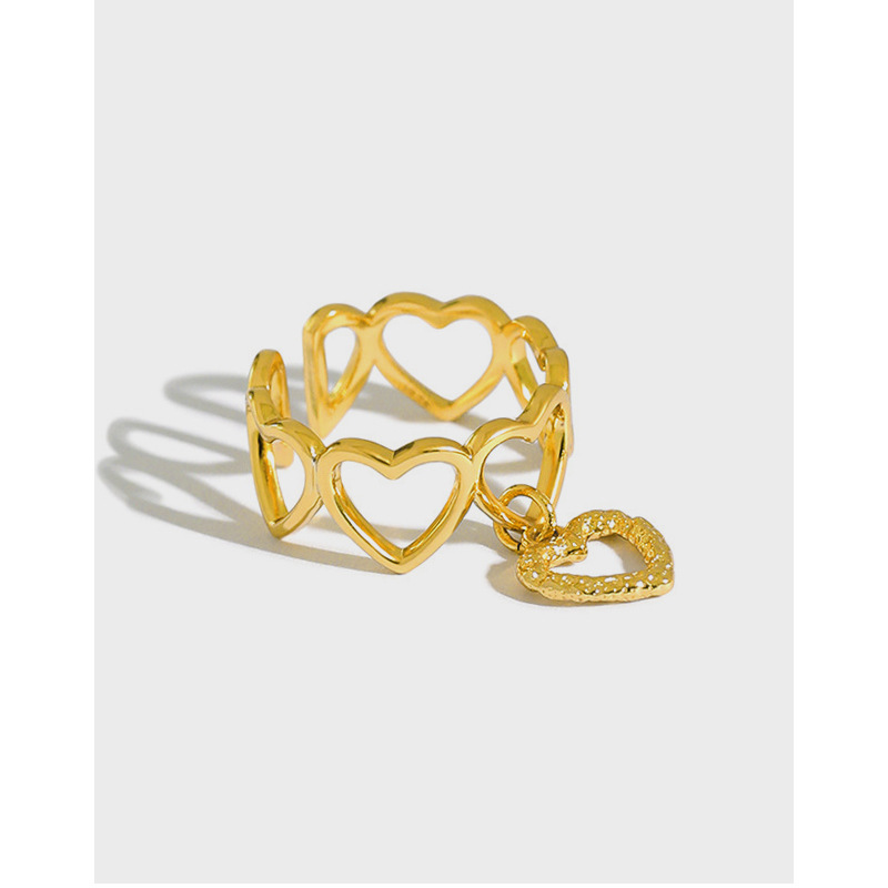 Silver hollow heart ring, embellished with small diamonds, expressing sincere love