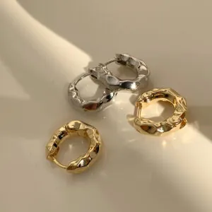 Stylish brass jewelry ear hoops minimalist metallic elegance comfort.